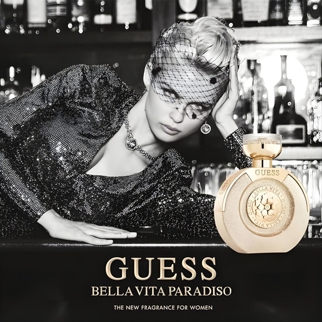 Refect Beauty Guess Bella Vita Paradiso perfume bottle next to a glamorous woman in a sequin dress and veil