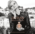 Refect Beauty Guess Bella Vita Rose perfume bottle held by a woman in a black lace top on a sunny terrace