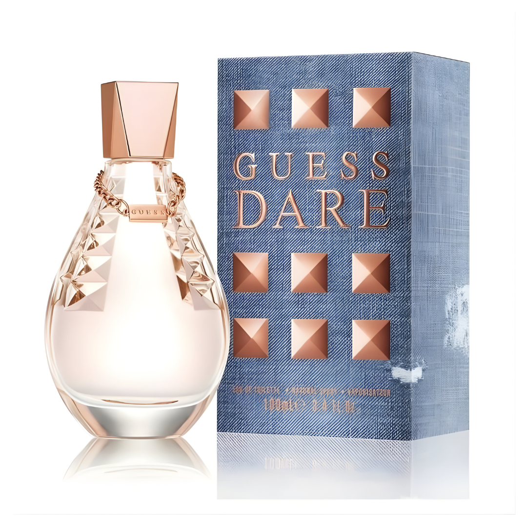 Refect Beauty Guess Dare Eau De Toilette perfume bottle with rose gold accents next to its blue denim-textured box.