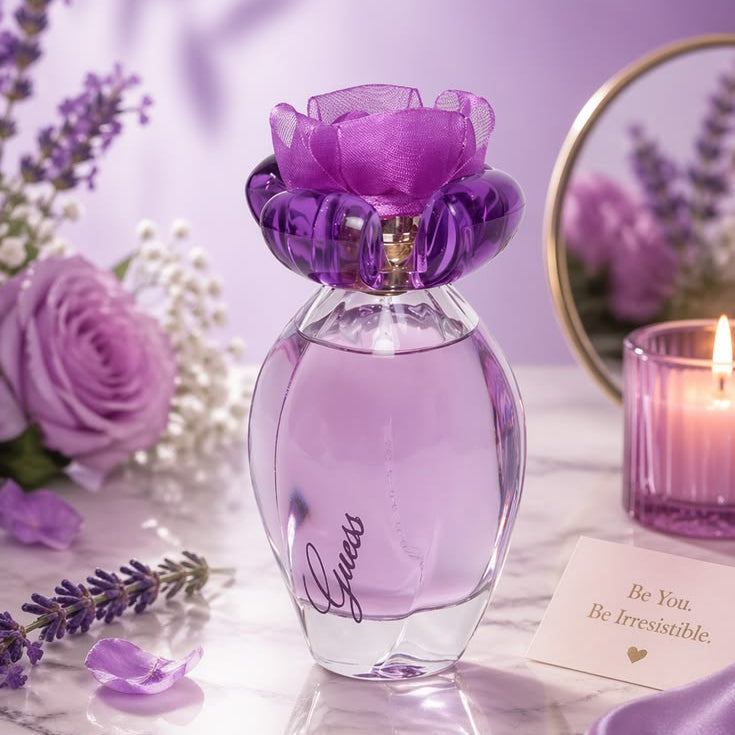 Refect Beauty Guess Girl Belle Eau de Toilette in a purple glass bottle with a floral cap on a decorated table