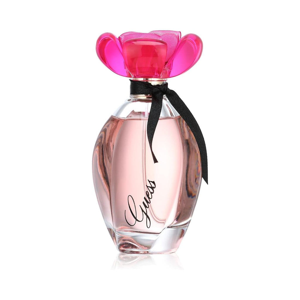 Refect Beauty Guess Girl Eau de Toilette in a glass bottle with a vibrant pink flower cap and black ribbon detail.