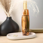 Refect Beauty Guess Marciano for Women eau de parfum bottle in amber glass with floral accents on a white tray