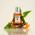 Refect Beauty Guess Originals Type 3 Tobacco & Amberwood perfume bottle surrounded by orange peels and vanilla beans