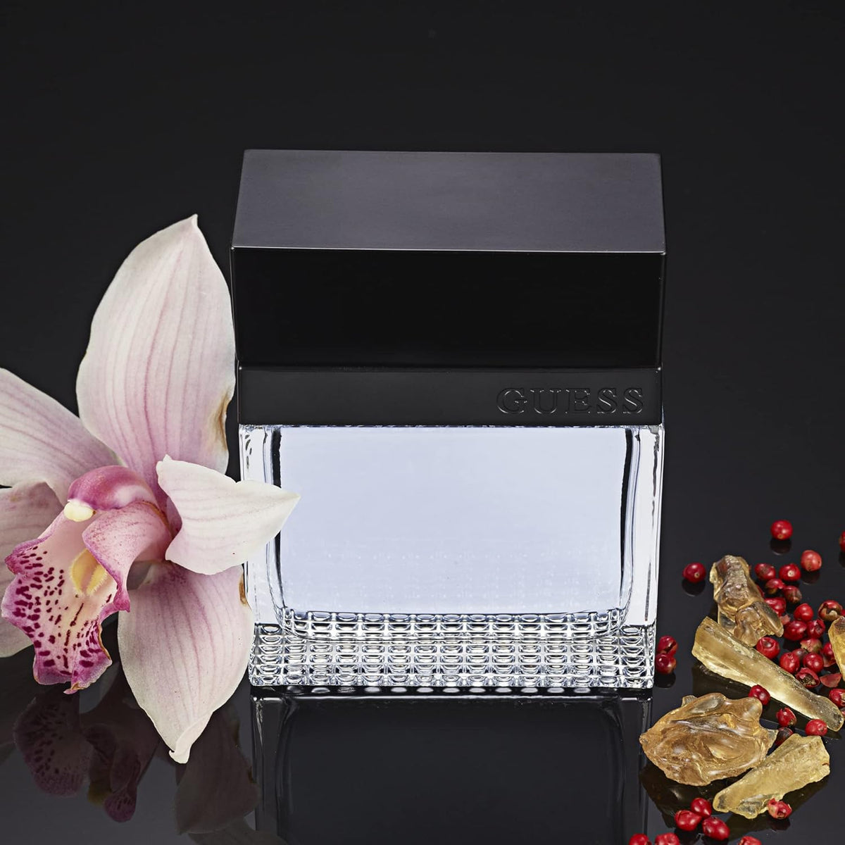 Refect Beauty Guess Seductive Homme fragrance bottle with orchid flower, pink peppercorns, and amberwood accents