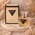Refect Beauty Guess Seductive Eau de Toilette perfume bottle and box on a decorative tray with dried flowers