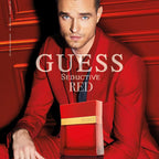 Refect Beauty Guess Seductive Red for Men eau de toilette bottle in front of a man wearing a red suit