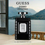 Refect Beauty Guess Uomo Intenso Eau de Parfum in a sleek black bottle against a scenic lake and mountain backdrop.