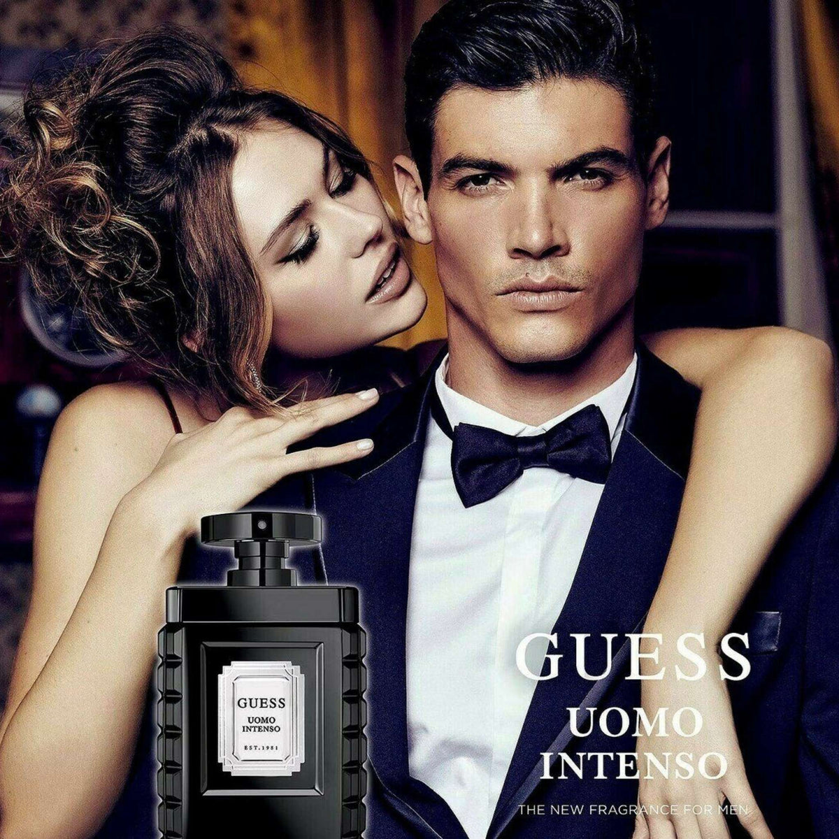 Refect Beauty Guess Uomo Intenso Eau de Parfum bottle next to an elegant couple in formal evening wear