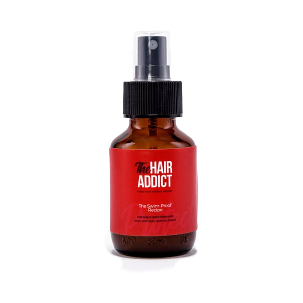 Refect Beauty Hair Addict The Swim Proof Recipe protective hair spray in an amber glass bottle with a black pump.