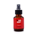 Refect Beauty Hair Addict The Swim Proof Recipe protective hair spray in an amber glass bottle with a black pump.