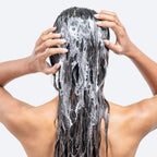 Refect Beauty Hair Burst shampoo lathering on long dark hair to promote stronger and healthier hair growth