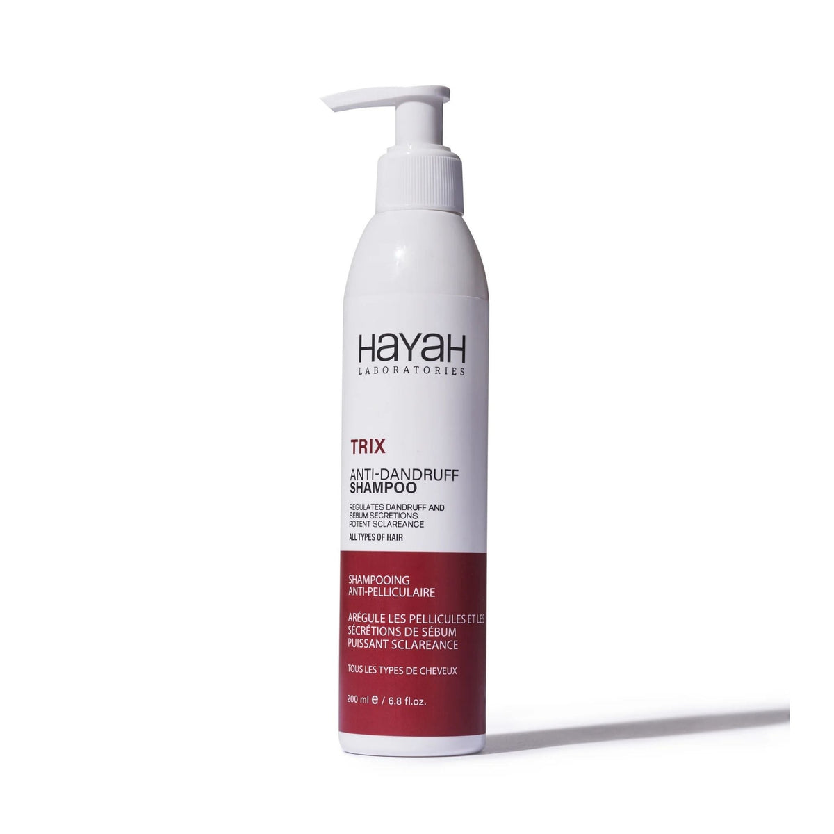 Refect Beauty Hayah Trix anti-dandruff shampoo bottle with a pump dispenser for scalp care and flake reduction.