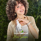 Refect Beauty Hepta Panthenol hair shampoo bottle held by a smiling woman with curly hair in a lush garden setting