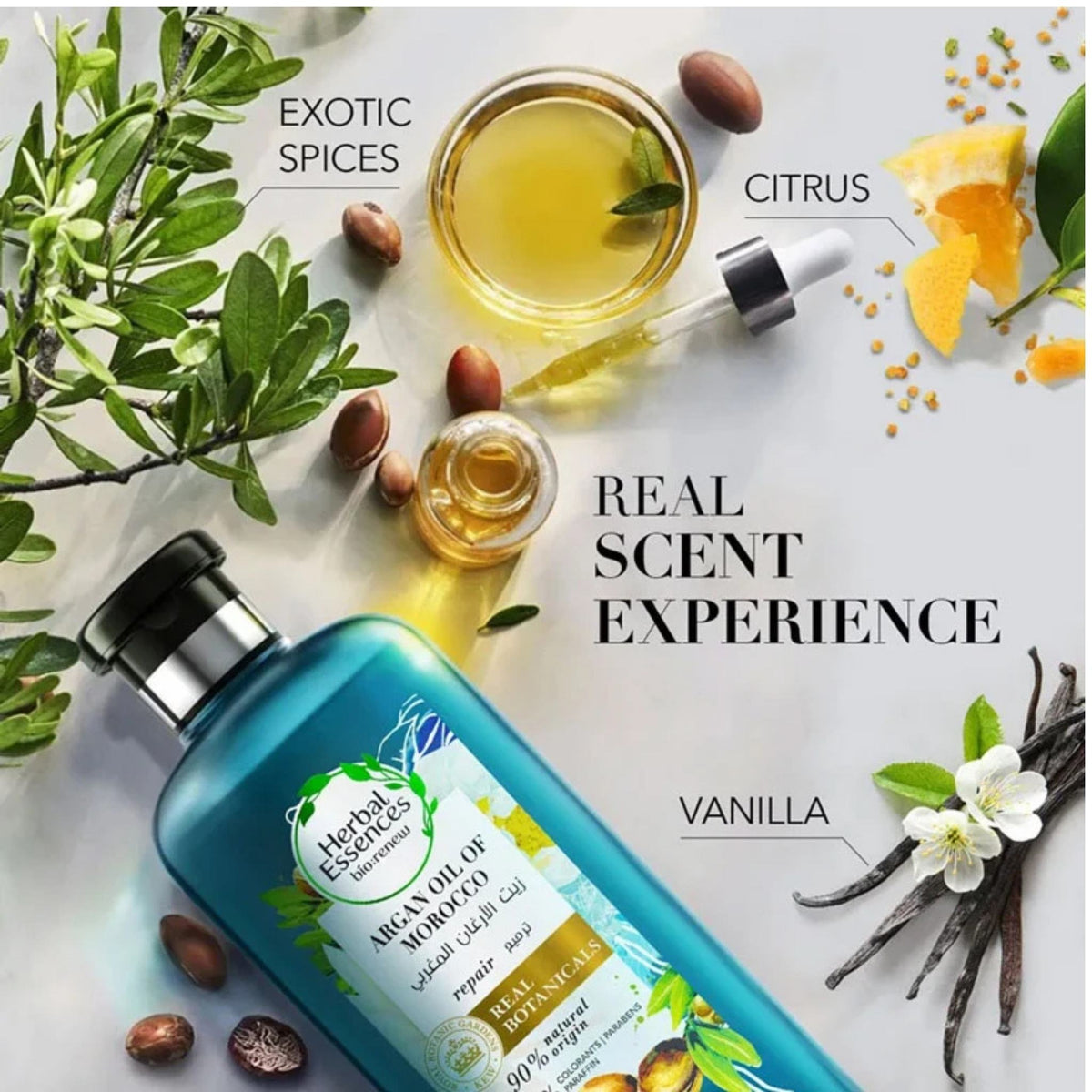 Refect Beauty Herbal Essences Argan Oil of Morocco shampoo bottle surrounded by argan nuts, citrus, and vanilla.