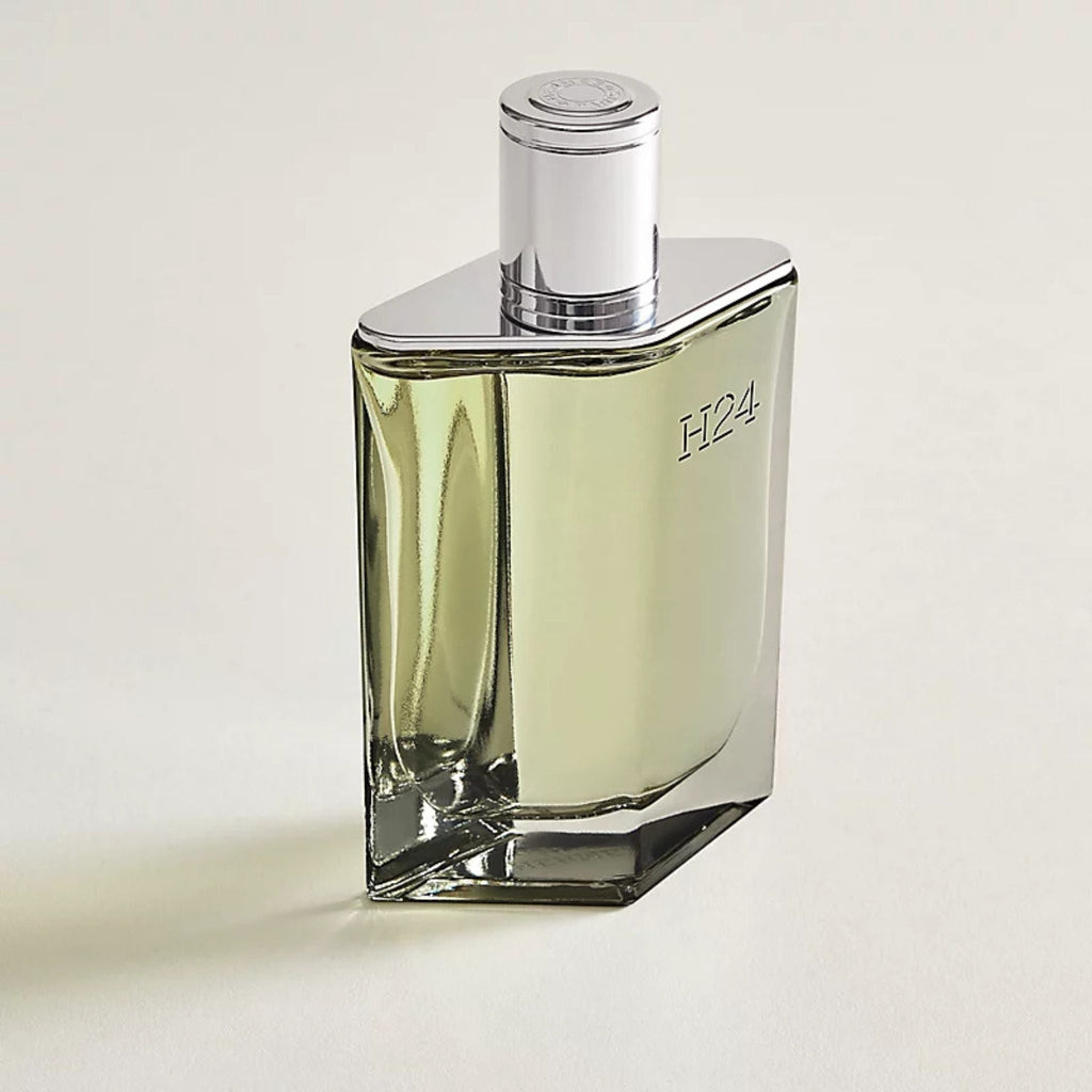 Refect Beauty Hermès H24 Eau de Parfum in a sleek, refillable glass bottle with a silver cap and light green fragrance.