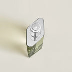 Refect Beauty Hermès H24 Eau de Parfum in a sleek, refillable glass bottle with a silver cap, top-down view.