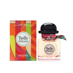 Refect Beauty Hermès Twilly d’Hermès Eau de Parfum bottle with a silk ribbon and its vibrant orange patterned box.