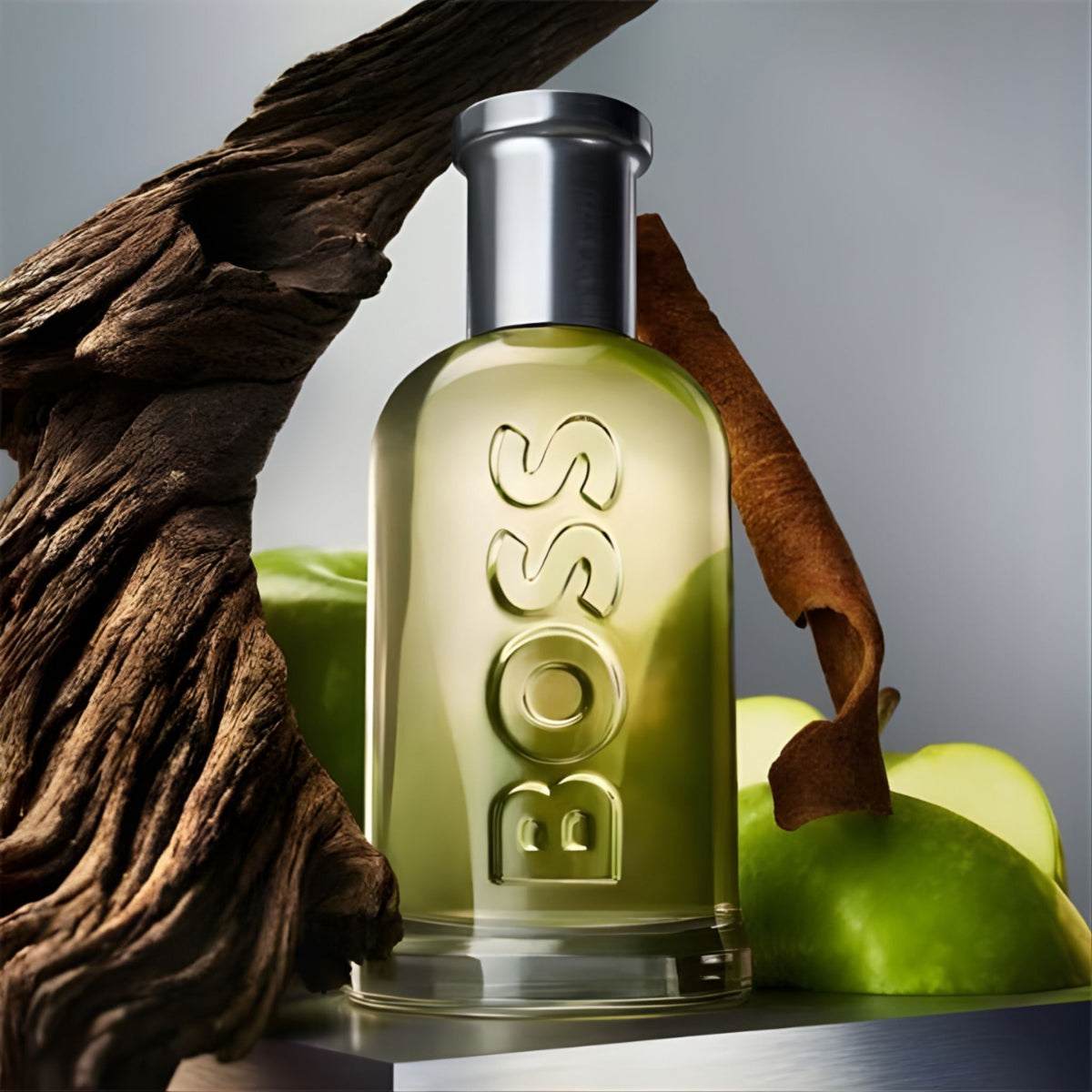 Refect Beauty Hugo Boss Bottled Eau de Toilette fragrance bottle with apple and wood accents on a grey background