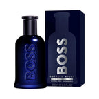 Refect Beauty Hugo Boss Bottled Night Eau de Toilette in a dark blue glass bottle next to its matching navy box