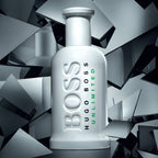 Refect Beauty Hugo Boss Bottled Unlimited Eau de Toilette in a white bottle set against a shattered mirror background.