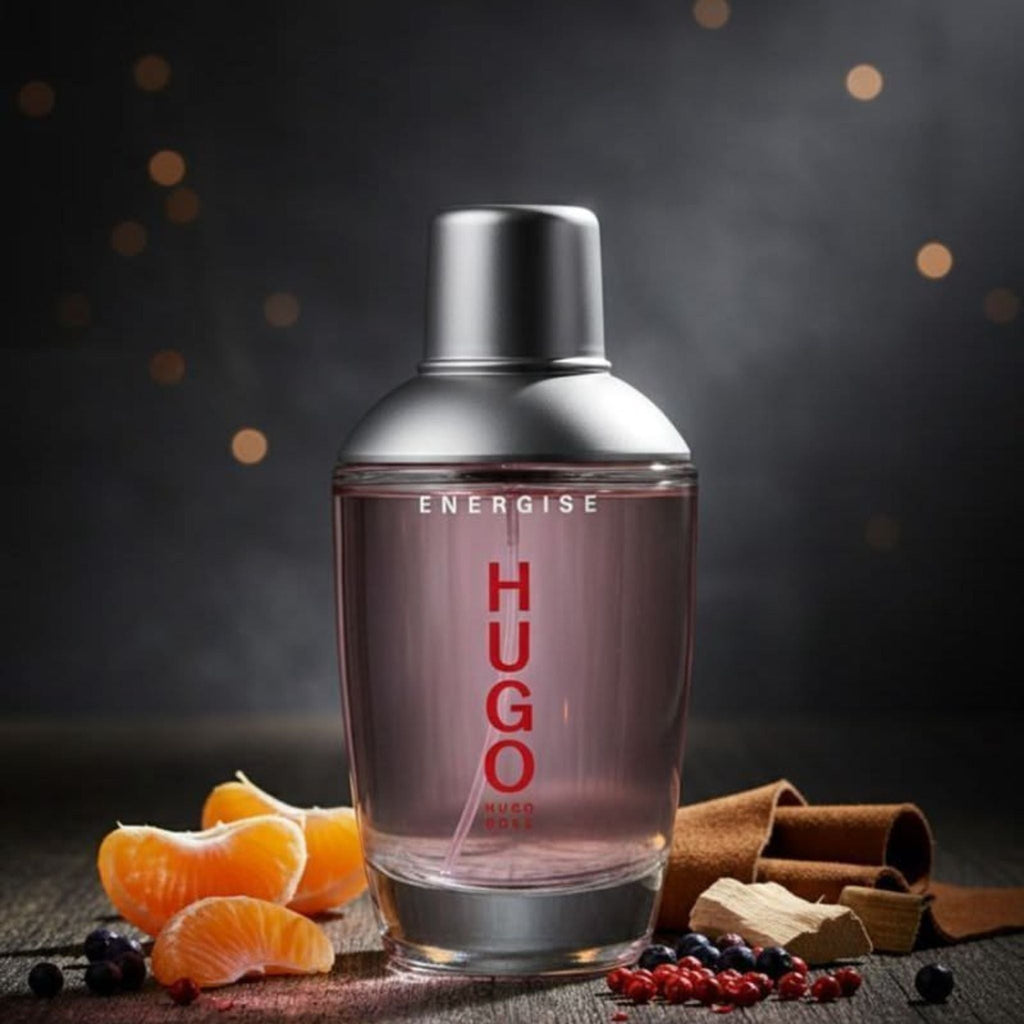 Refect Beauty Hugo Boss Energise Eau de Toilette bottle with citrus and spice accents on a dark wooden surface.