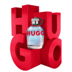 Refect Beauty Hugo Boss Hugo Man eau de toilette glass bottle with green cap in front of large red HUGO lettering