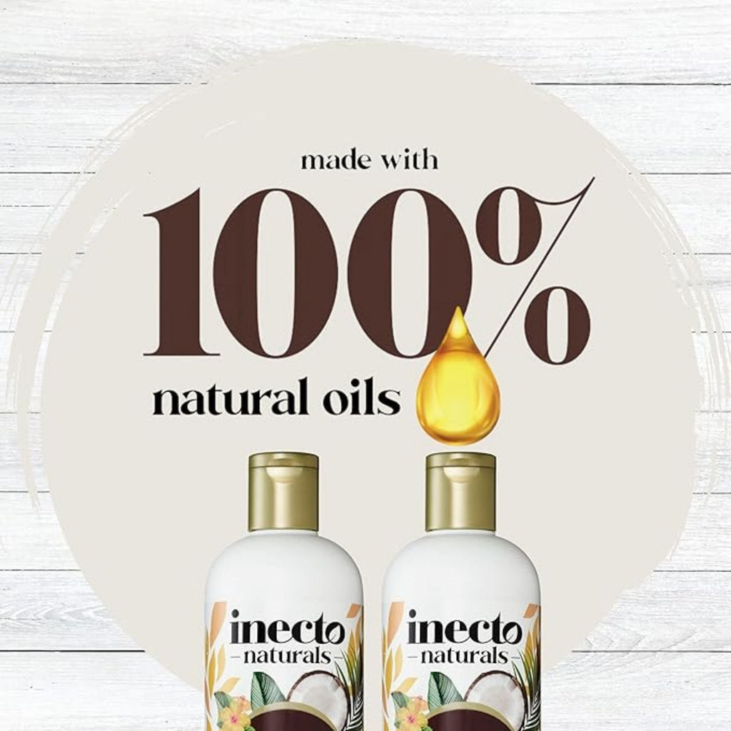 Refect Beauty Inecto Naturals coconut shampoo bottles featuring 100 percent natural oils branding on a wooden background