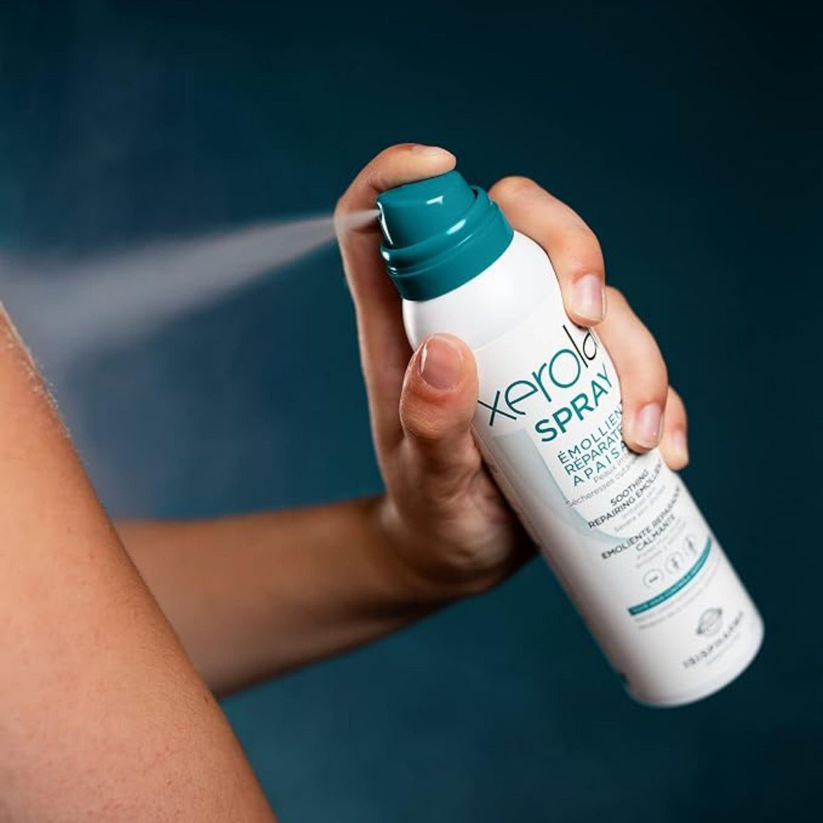 Refect Beauty Isispharma Xerolan soothing emollient spray being applied to skin for relief of itching and dryness