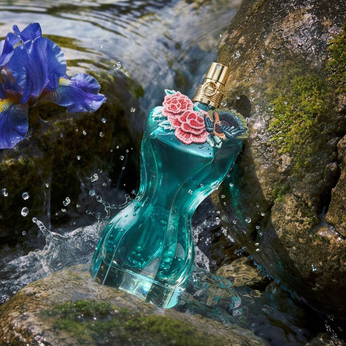 Refect Beauty Jean Paul Gaultier La Belle Paradise Garden perfume bottle with floral embroidery in a rocky water stream