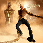 Refect Beauty Jean Paul Gaultier Le Male Elixir Absolu perfume bottle next to a sailor model in a golden desert setting.