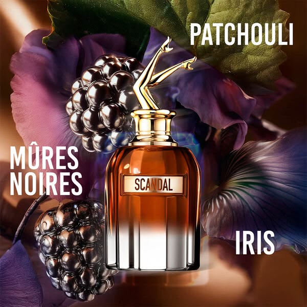 Refect Beauty Jean Paul Gaultier Scandal Elixir Parfum bottle with iconic legs cap, surrounded by blackberries and iris