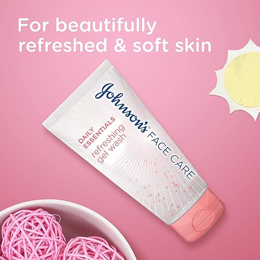 Refect Beauty Johnsons Daily Essentials Refreshing Gel Wash tube on a pink background with decorative spheres.