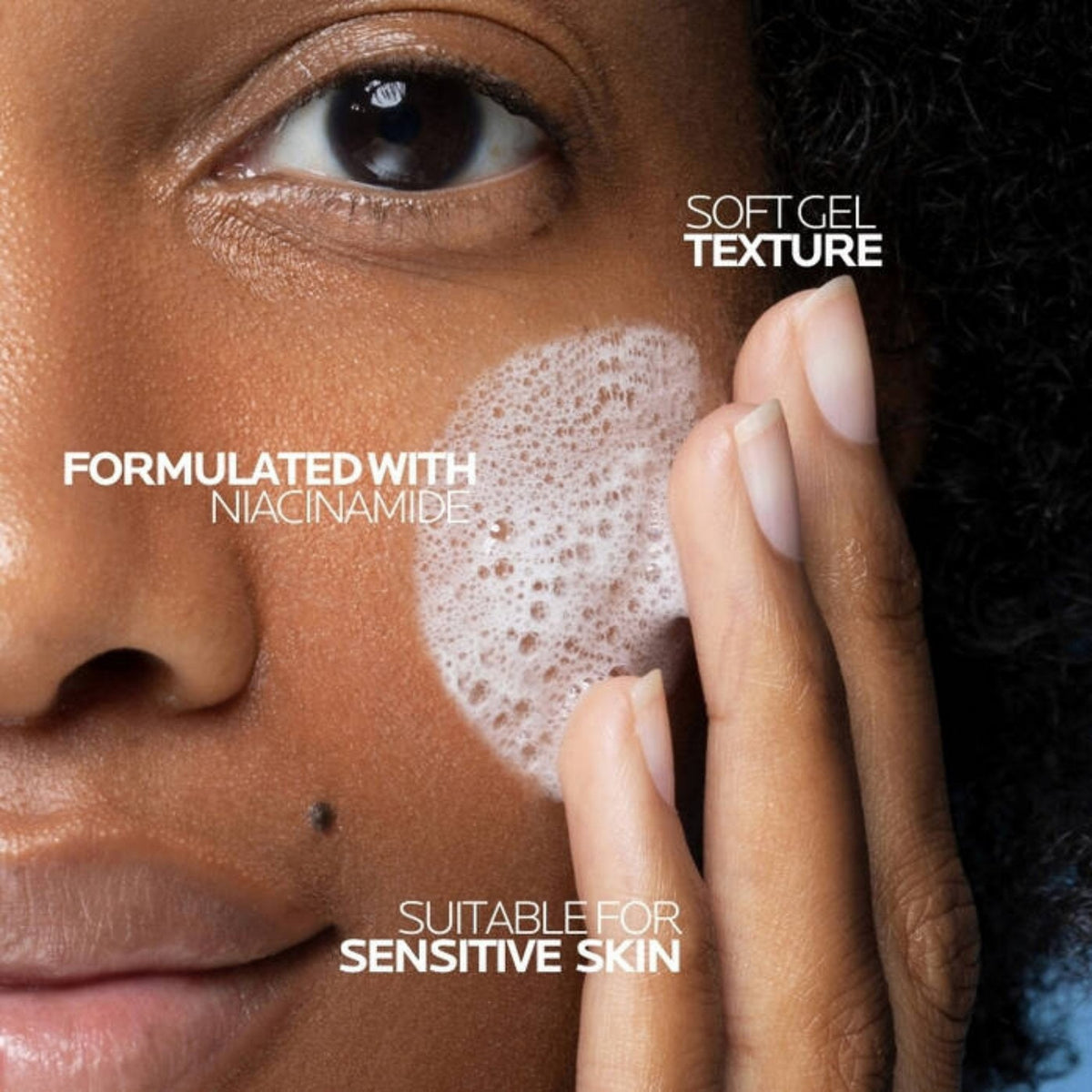 Refect Beauty La Roche-Posay Effaclar H ISO-BIOME cleansing cream applied to a person's cheek with soft foam texture