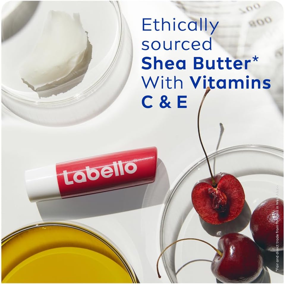 Refect Beauty Labello Shine Cherry lip balm with shea butter, vitamins C and E, and fresh cherries on a white surface.