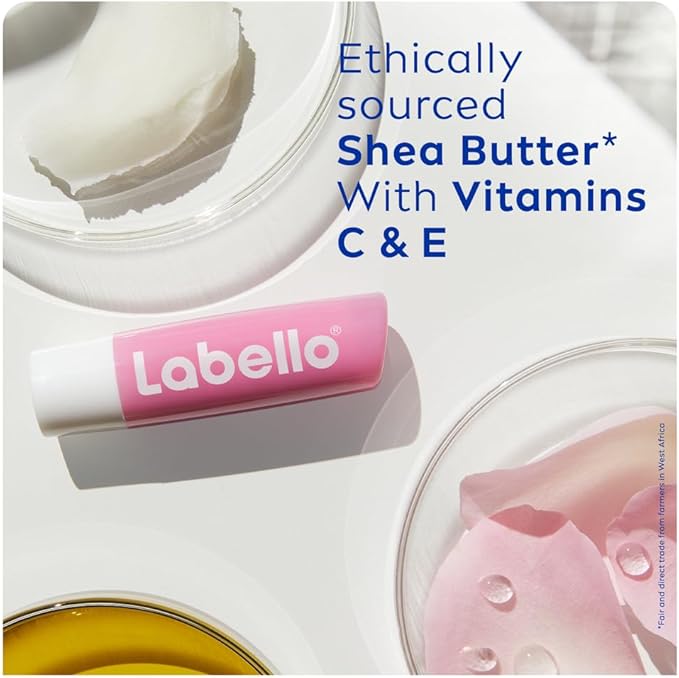 Refect Beauty Labello Soft Rose lip balm with shea butter, vitamins C and E, and rose petals on a white surface.