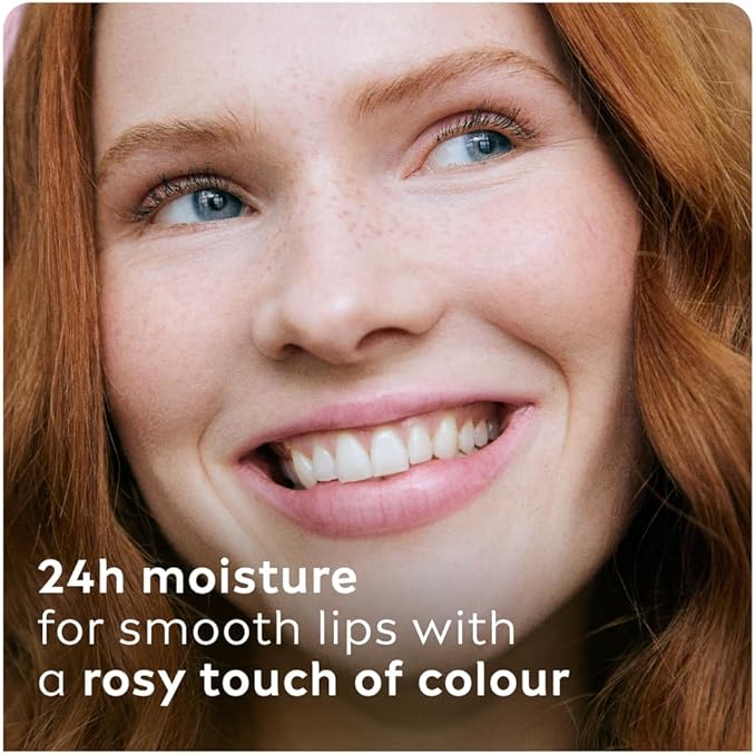 Refect Beauty Labello Soft Rose lip balm on a smiling woman with red hair, showing smooth lips with a rosy tint.
