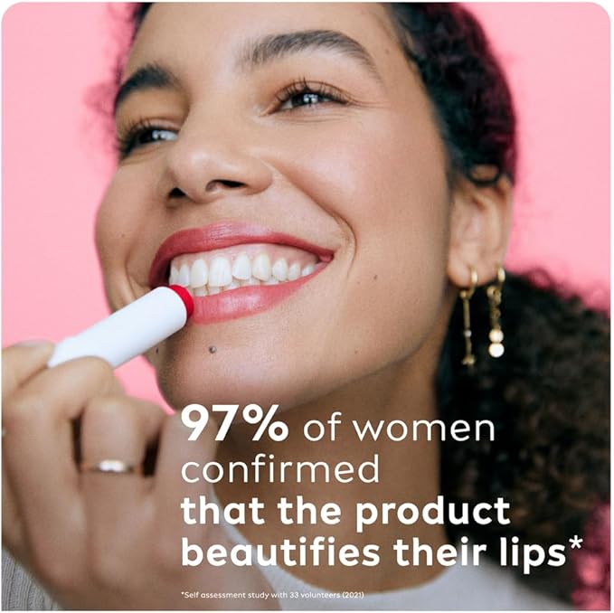 Refect Beauty model applying Labello Strawberry Shine lip balm for a glossy red tint and hydrated lips