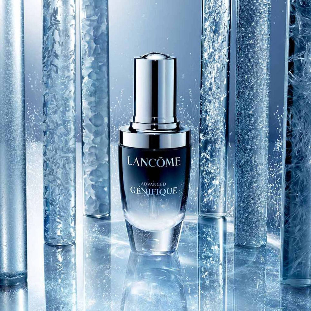 Refect Beauty Lancôme Advanced Génifique youth activating serum bottle in a blue, icy, crystalline setting.