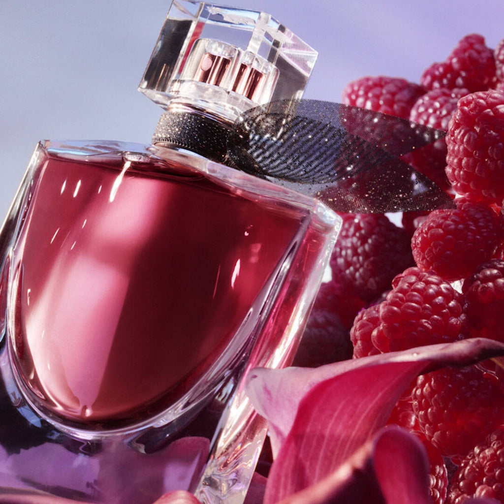 Refect Beauty Lancome La Vie Est Belle L'Elixir perfume bottle with deep pink liquid, raspberries, and floral accents