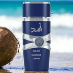 Refect Beauty Lattafa Asad Zanzibar Eau de Parfum bottle with blue design and silver accents on a tropical beach