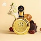 Refect Beauty Lattafa Fakhar Extrait perfume bottle in gold with tuberose flowers, leather, and amber on beige background