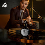 Refect Beauty Lattafa Fakhar Eau de Parfum bottle on a table with a man in a suit in the background