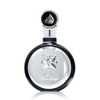 Refect Beauty Lattafa Fakhar Eau de Parfum in a sleek round black and silver bottle with elegant embossed detailing.