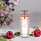 Refect Beauty Lattafa Mayar Eau de Parfum bottle with rose gold accents, surrounded by fresh raspberries and flowers.