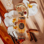 Refect Beauty Lattafa Pride Sehr Eau de Parfum in a gold ornate bottle surrounded by white orchids and cinnamon sticks