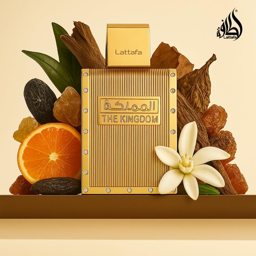 Refect Beauty Lattafa The Kingdom Eau de Parfum in a gold bottle surrounded by orange slices, flowers, and amber.