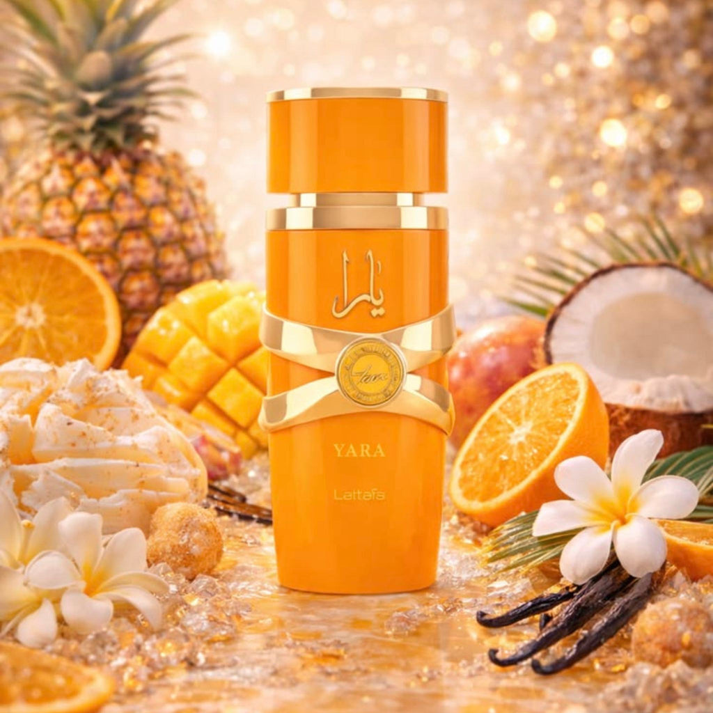 Refect Beauty Lattafa Yara Tous Eau de Parfum in a bright orange bottle surrounded by tropical fruits and flowers