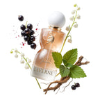 Refect Beauty Laverne Sense Forever perfume bottle surrounded by blackcurrants, lily of the valley, and green leaves.