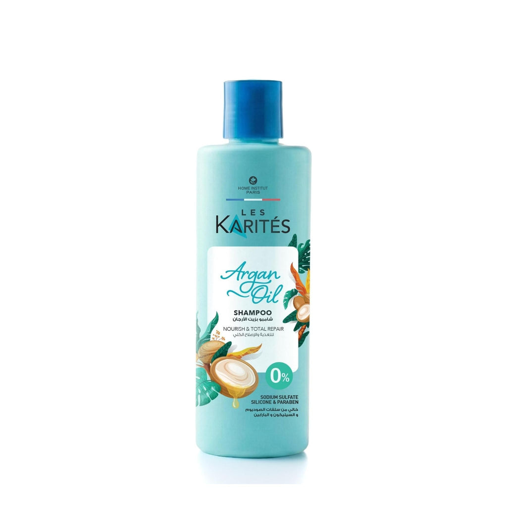 Refect Beauty Les Karités Argan Oil Shampoo in a light blue bottle for nourishing and repairing dry, damaged hair.