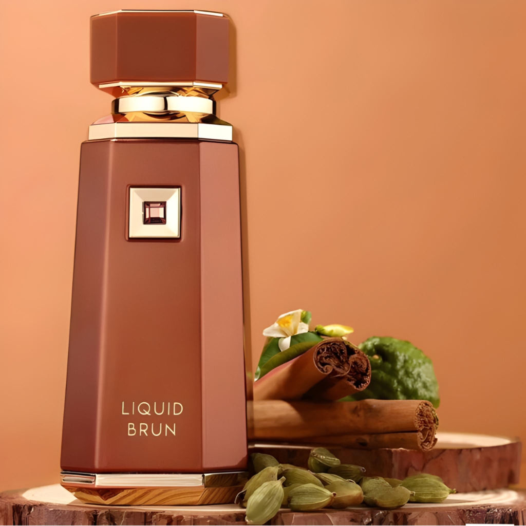 Refect Beauty French Avenue Liquid Brun eau de parfum bottle with cinnamon, cardamom, and bergamot on wood slices.